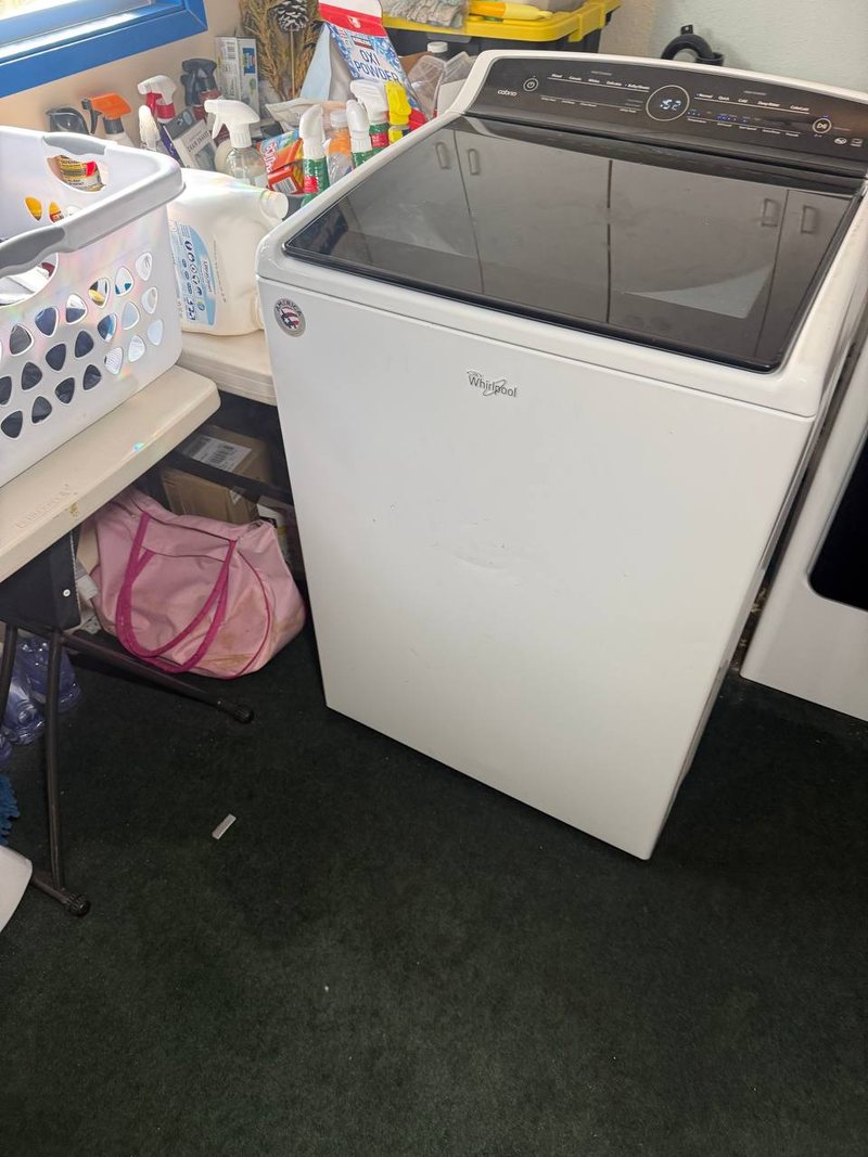 Whirlpool Cabrio top-load washer with the lid closed, ready for a drain and spin test